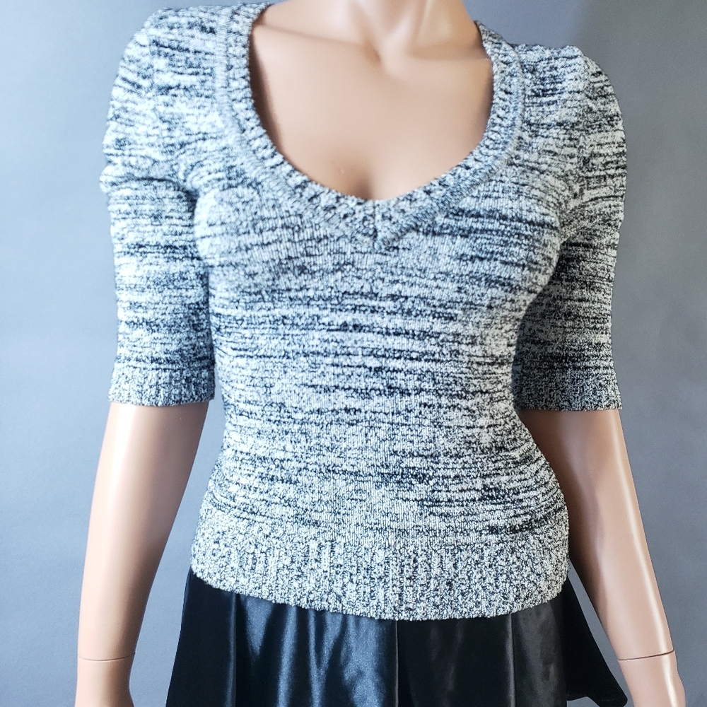 Bebe sweater Size Medium streach knit Black,White and Gray horizontal pattern
